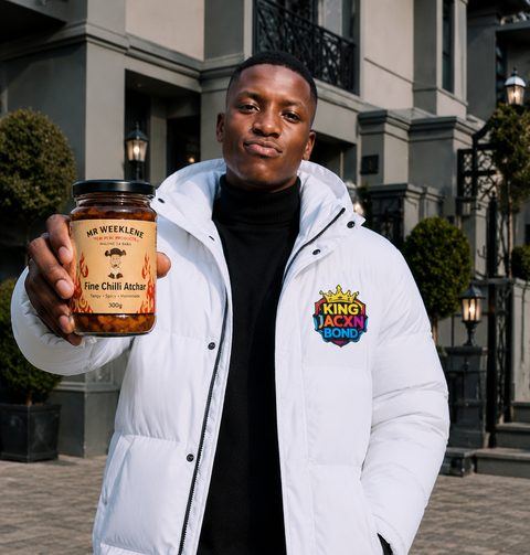 Happy Mr Weeklene customer holding Fine Chilli Atchar jar